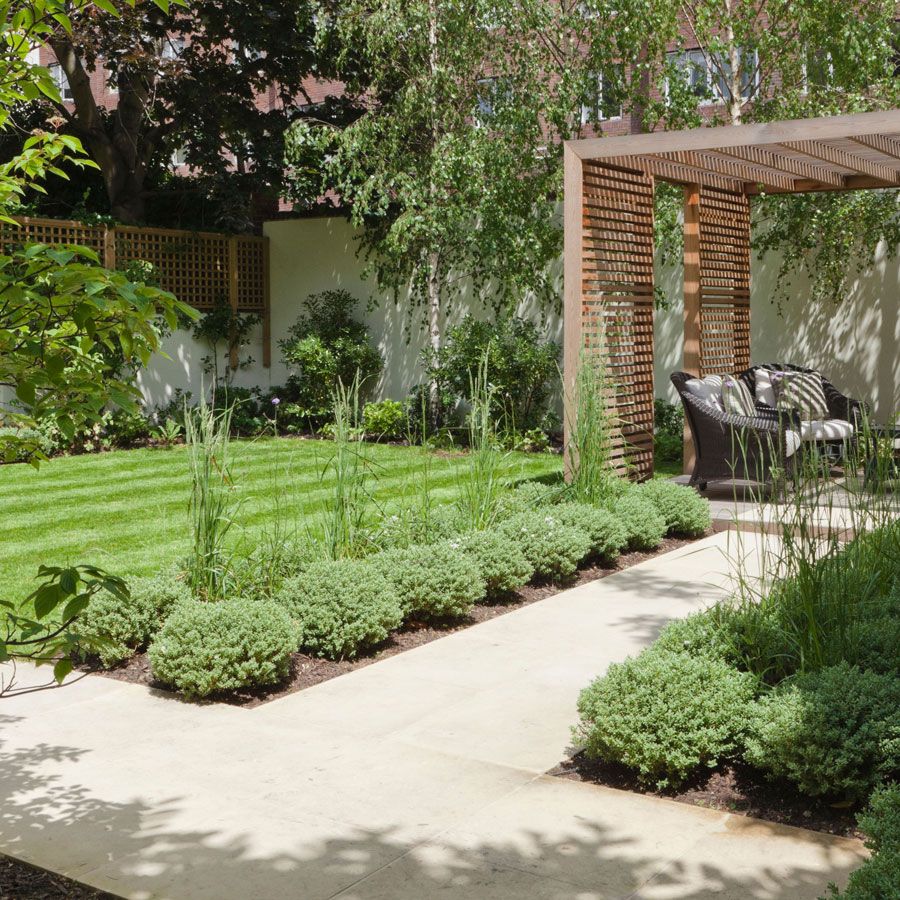 L-shaped garden design with lawn, path, trees and pergola