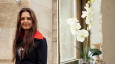 a split sctreen image with katie holmes on the left and a picture of a moth orchid on the right