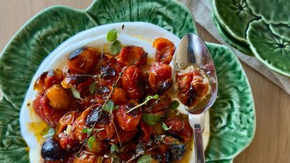 Plate or roast tomatoes and yogurt on a green dish