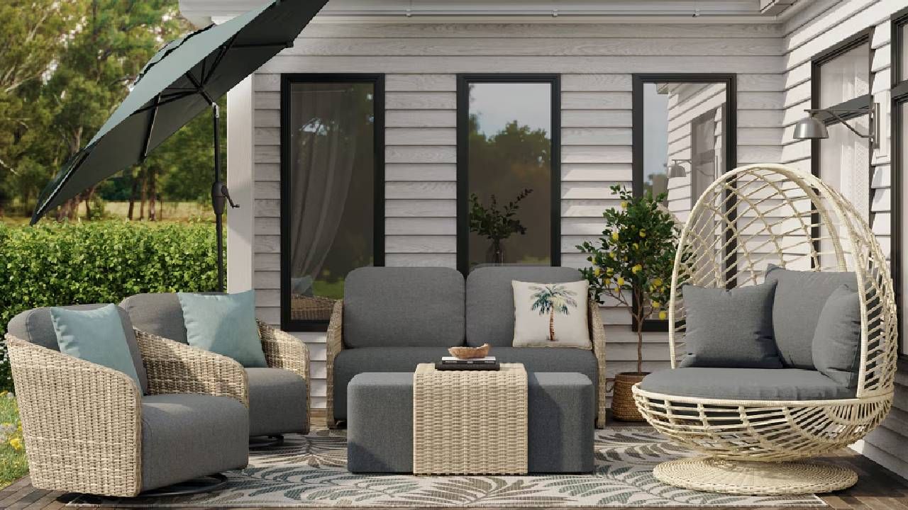 A modern patio with a variety of wicker outdoor furniture from Lowe's. 